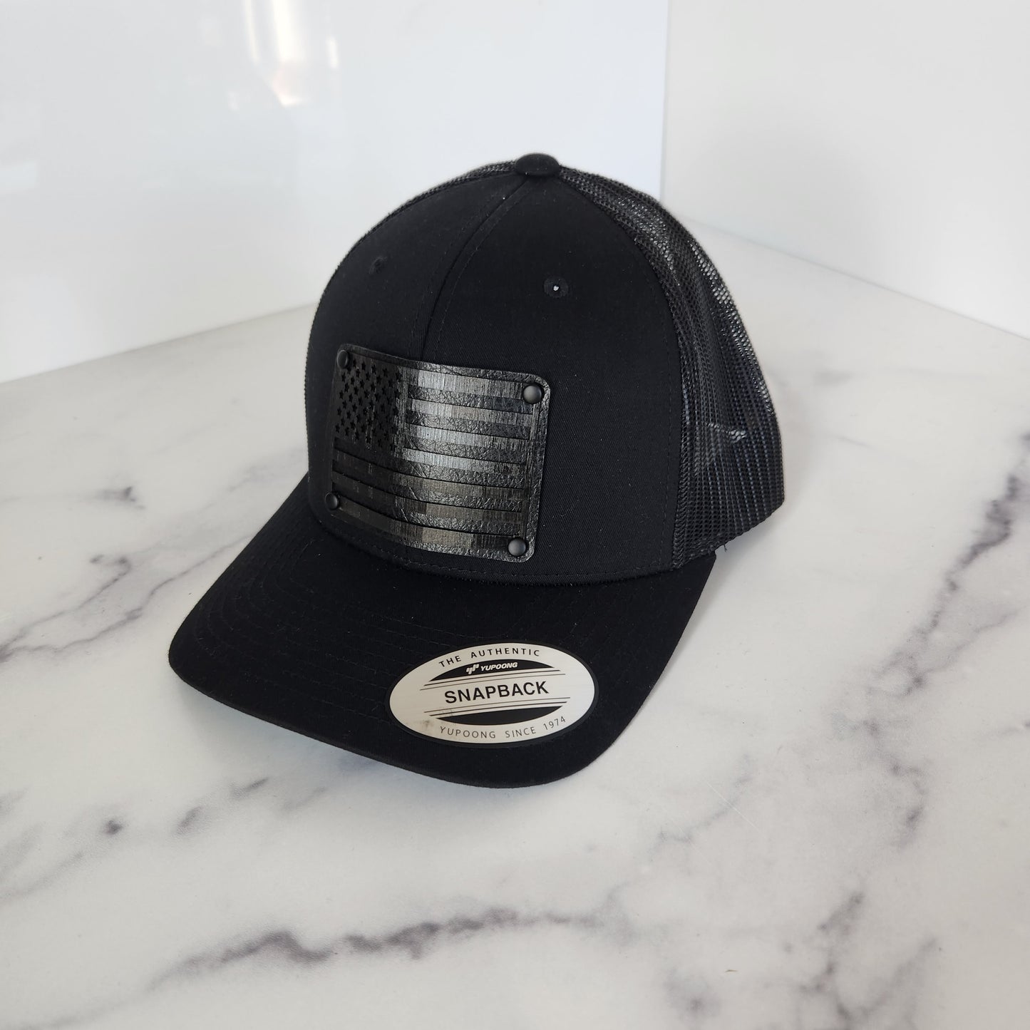 Flex Fit Trucker Hat with Black Flag Wooden Patch